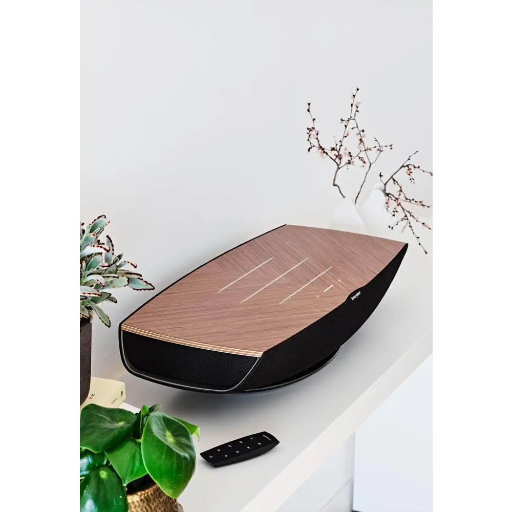 Modern wooden-top omnia all in one highend wireless speaker with sleek black sides and white accents compatible with sonus faber app